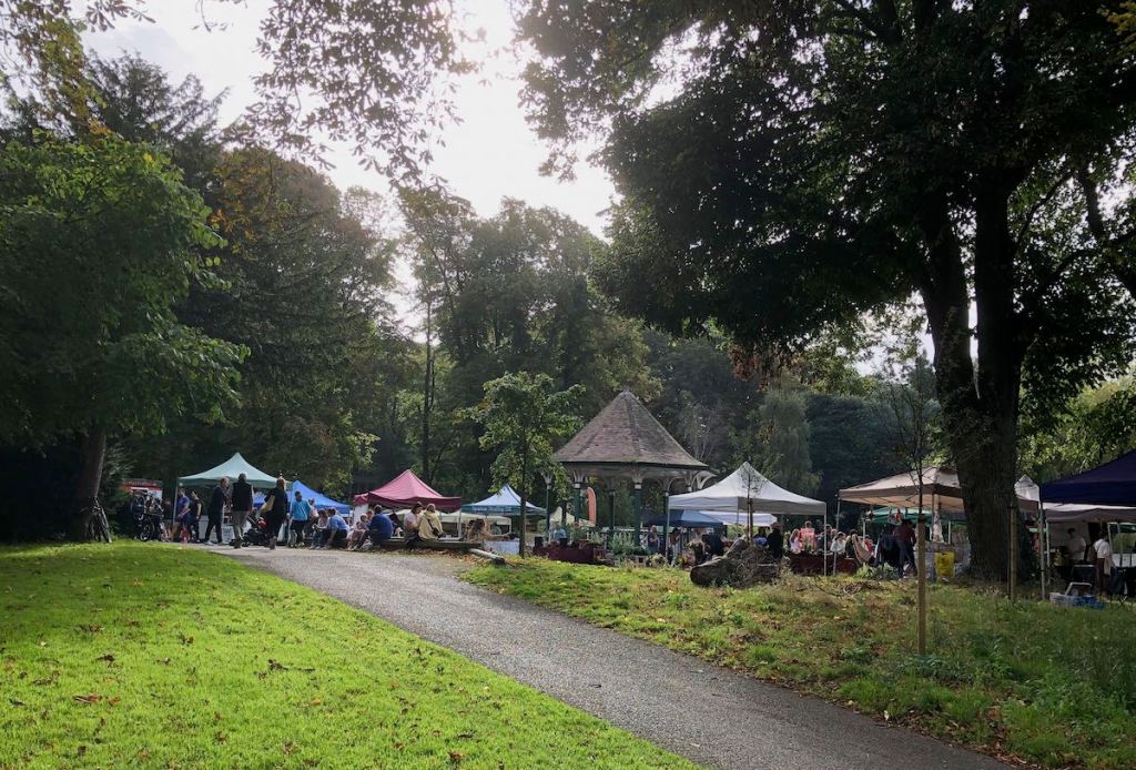 Market stalls clustered around a small bandstand in Herbert Park